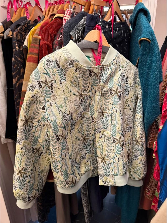 A botanical jacquard bomber jacket on display at House of Savoy.